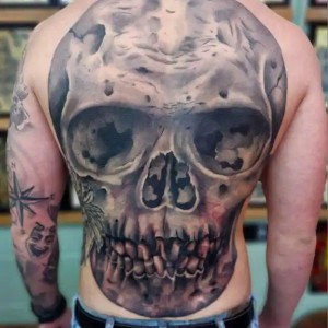 Skull full backpiece tattoo by Goon