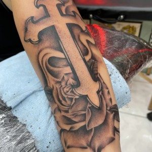 cross tattoo by Kawika