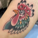 Rooster head tattoo by Kawika