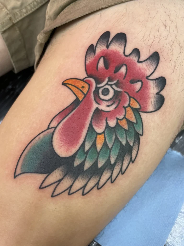 Rooster head tattoo by Kawika