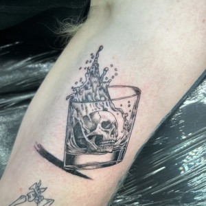 Realism skull in glass tattoo by Lumpy