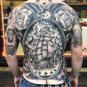 Full back black and grey pirate ship, eagle tattoo by Chris