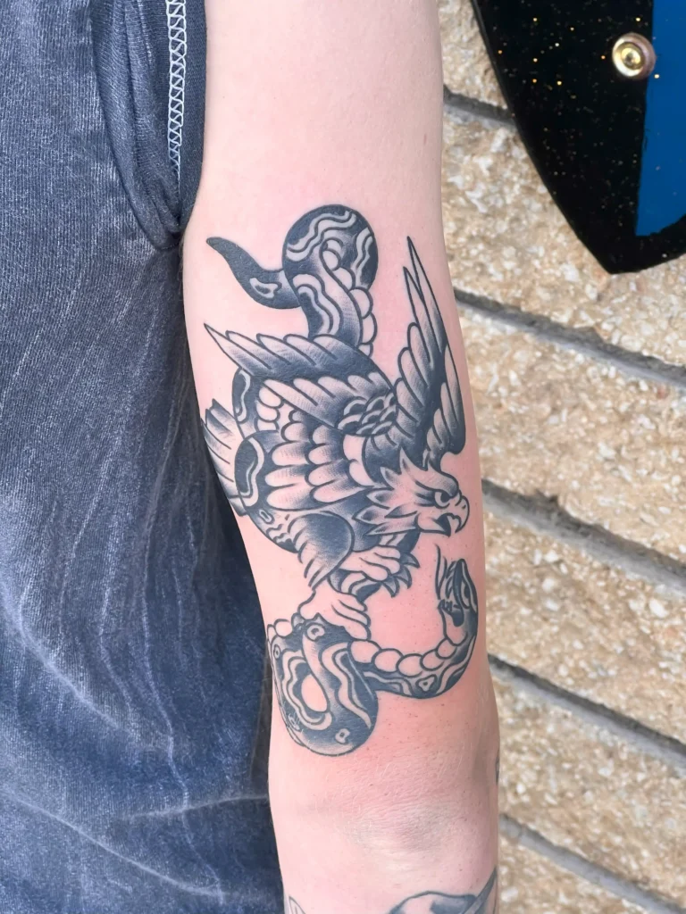 Eagle Clutching snake tattoo by Chris