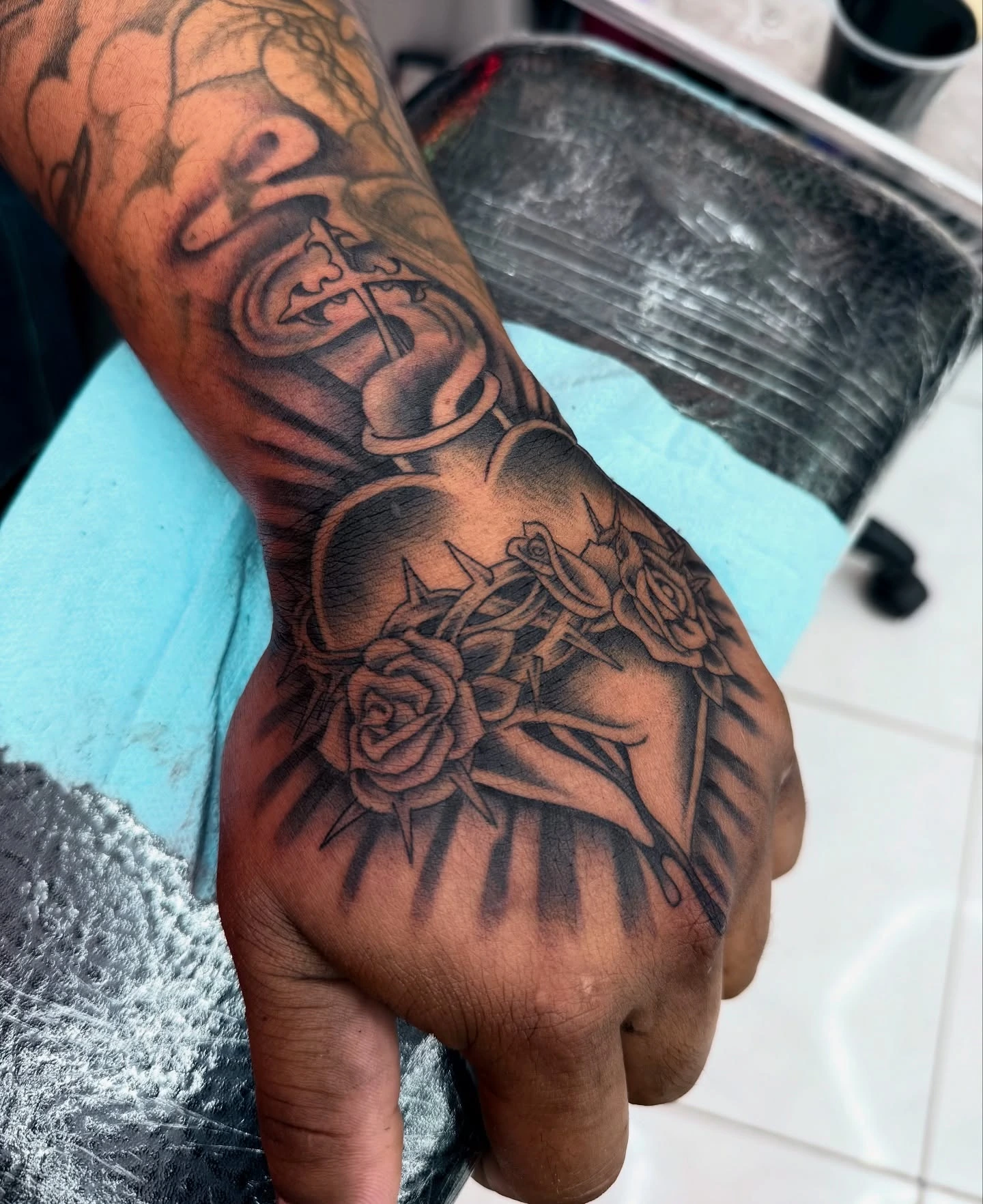 Hand heart tattoo