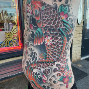 Kawika Traditional coy tattoo ribs