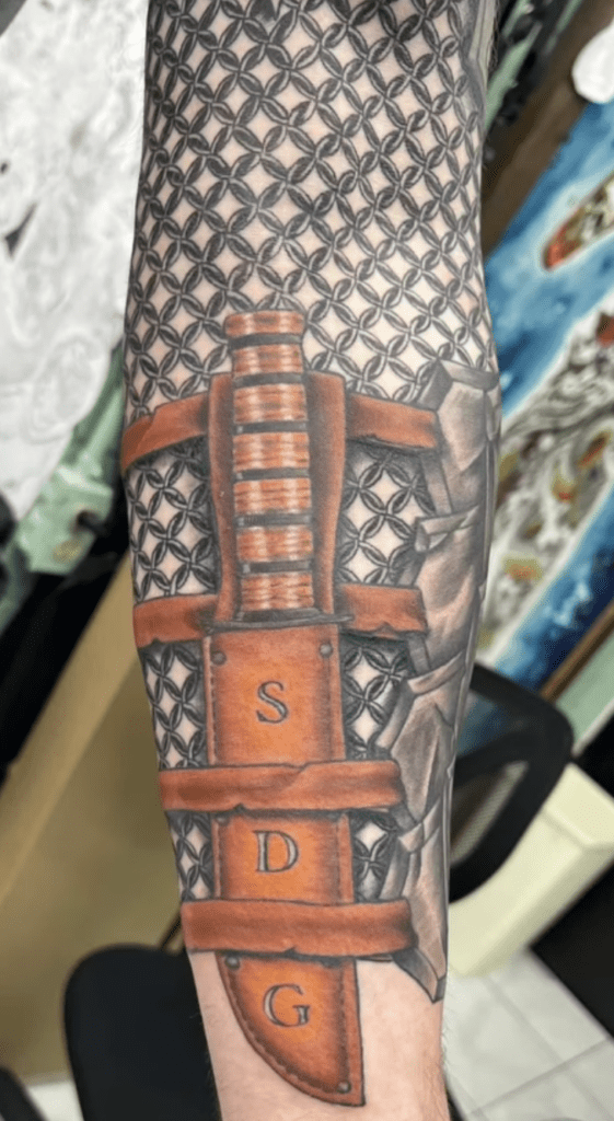 realism knife tattoo