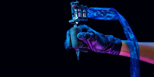 tattoo artist with a tattoo machine