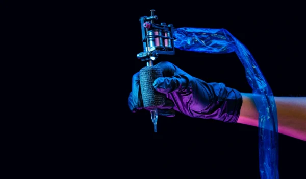 tattoo artist with a tattoo machine
