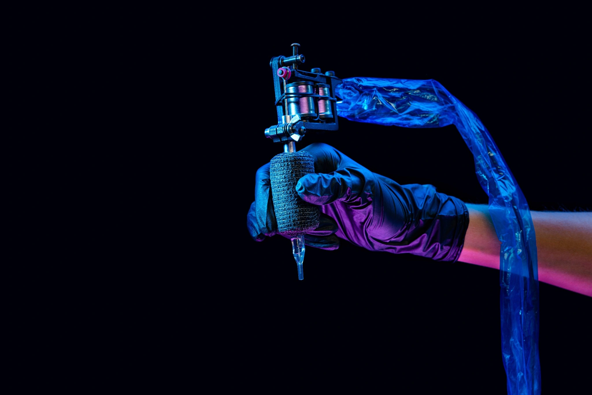 tattoo artist with a tattoo machine